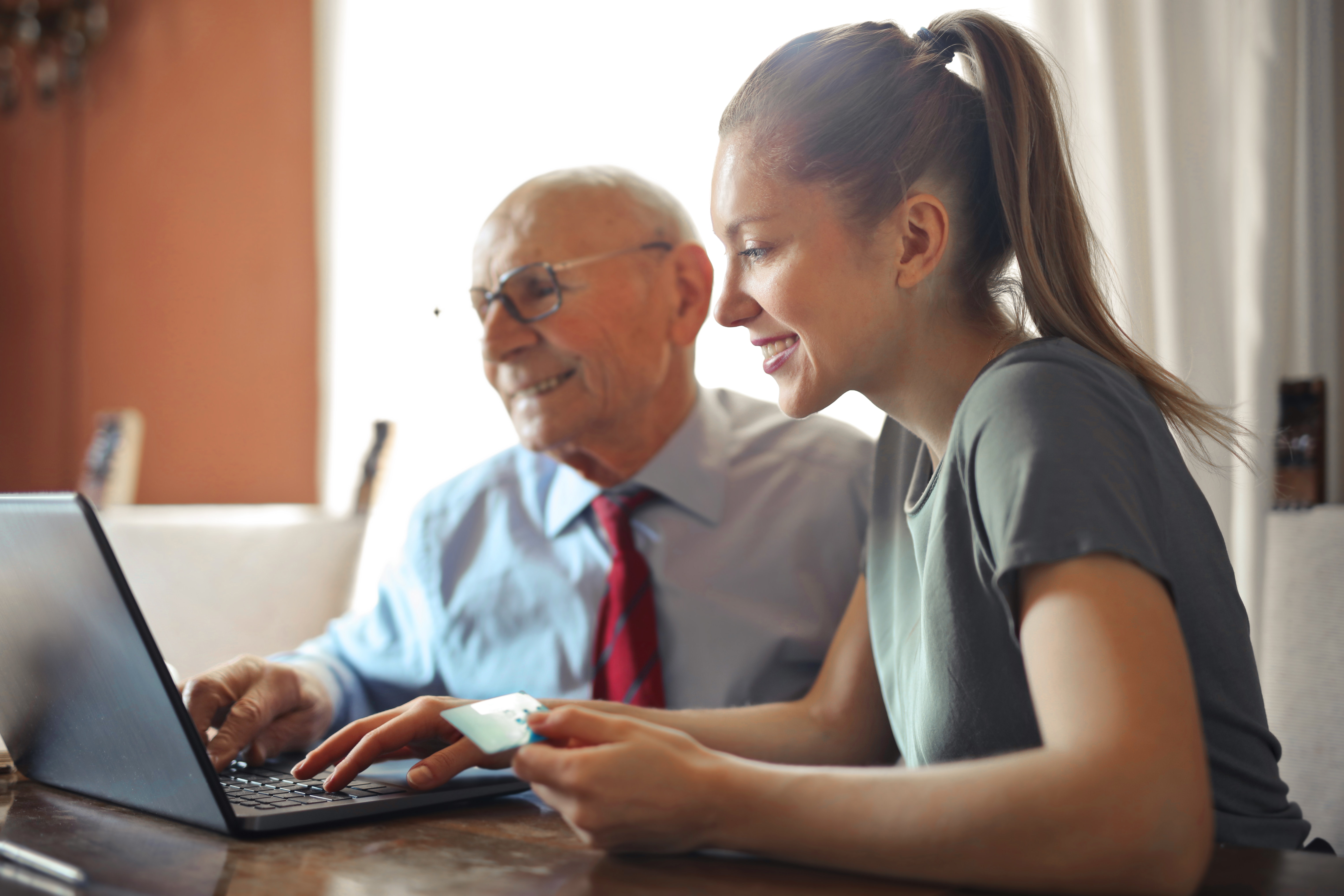 Two people on laptop